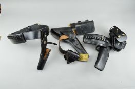 THREE REVOLVER HOLSTERS AND AMMUNITION BELTS, the first is by Alamo Leather Goods Co, San Antonio,