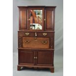 A GEORGE III MAHOGANY SECRETAIRE CABINET, the upper breakfront section with central mirrored