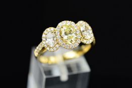 AN IMPRESSIVE MODERN DIAMOND TRIPLE CLUSTER RING, three principle oval mixed cut diamonds enclosed