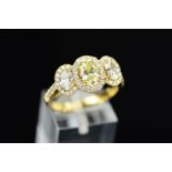 AN IMPRESSIVE MODERN DIAMOND TRIPLE CLUSTER RING, three principle oval mixed cut diamonds enclosed