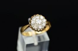 A DIAMOND CLUSTER RING, designed as a cluster of old and modern round brilliant-cut diamonds,