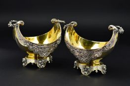 A PAIR OF LATE VICTORIAN ELKINGTON & CO PARCEL GILT ELECTROPLATE TWIN HANDLED SWEETMEAT BASKETS,