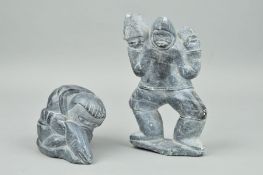 JIMMIE SMITH, an Inuit stone carving of a man in Inuit costume holding a fish, incised artist name