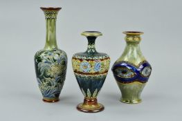 THREE DOULTON LAMBETH VASES, the first is a baluster shaped vase with squared mid section
