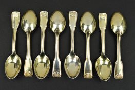 A SET OF EIGHT CONTINENTAL SILVER GILT FIDDLE, THREAD AND SHELL PATTERN COFFEE SPOONS, gilding