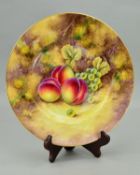 A ROYAL WORCESTER PLATE HAND PAINTED WITH PEACHES AND GRAPES ON A MOSSY BANK, bears signature for
