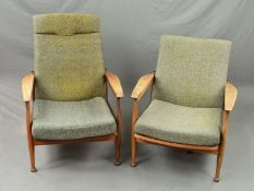 TWO GUY RODGERS MANHATTAN LADIES AND GENTS ARMCHAIRS, with shaped armrests on cylindrical tapering