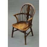 AN EARLY 20TH CENTURY CHILD'S WINDSOR ELBOW CHAIR, in stained ash and beech, pierced vase splat