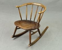 A DARK ERCOL COW HORN STICK BACK ROCKING CHAIR, (condition: few light scratches, varnish faded to