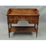 A VICTORIAN MAHOGANY WASHSTAND, the rectangular top with raised back and sides above an