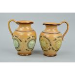 A PAIR OF DOULTON LAMBETH MOTTO EWERS, each with four plaques, the first motto is an appreciation of