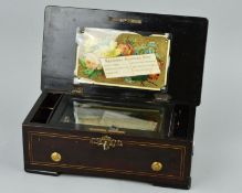 A LATE 19TH CENTURY MUSIC BOX IN A ROSEWOOD STAINED CASE, the hinged lid with 'National Musical Box'