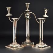 A LATE 19TH CENTURY SILVER PLATED THREE LIGHT CANDELABRUM AND MATCHING PAIR OF CANDLESTICKS,