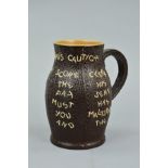 A DOULTON LAMBETH 'THE LANDLORDS CAUTIONS' BLACKJACK JUG, with a warning script over the Slaters