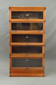 A GLOBE WERNICKE WALNUT FIVE SECTIONAL BOOKCASE, with glazed fall front doors, comprising of four