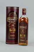 A BOTTLE OF BUSHMILLS SINGLE MALT IRISH WHISKEY, aged 16 years old, matured in three woods, 40% vol,