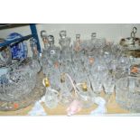 A GROUP OF CUT GLASSWARES, etc, to include decanters, scent bottles, candlesticks, glasses, etc