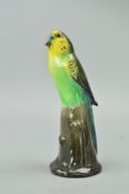 A ROYAL DOULTON BUDGERIGAR ON TREE STUMP, green yellow and black, HN163, approximate height 17cm