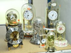 EIGHT MODERN CLOCKS INCLUDING TWO WITH CAPODIMONTE CERAMIC BASES, a Rhythm quartz musical clock, etc