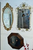 A GILT OVAL WALL MIRROR, an oak bevelled edge mirror and another mirror (3)