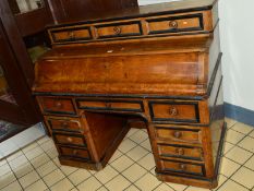 A VICTORIAN POLLARD OAK AND EBONISED KNEE HOLE DESK, the pull out section with a fold over