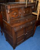 AN OAK COURT CUPBOARD, with two drawers, approximate size width 107cm x depth 54cm x height 134cm