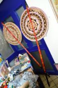 A PAIR OF BUDDIST CEREMONIAL FANS, possibly from Sri Lanka, decorated with circular motifs to the