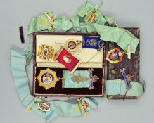 FOUR EARLY 20TH CENTURY MEDALS, A MEDAL RIBBON AND A MASONIC BALL, to include a light role of honour