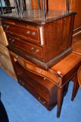 A REPRODUCTION MAHOGANY SERPENTINE HALL TABLE, a low two door chest of drawers, a TV cabinet, a nest