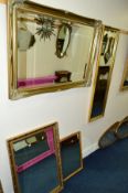 A LARGE MODERN GILT FRAMED BEVELLED EDGE WALL MIRROR, two other gilt framed mirrors and an oak
