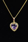 AN EARLY 20TH CENTURY AMETHYST AND SPLIT PEARL PENDANT AND CHAIN, the heart shape amethyst within