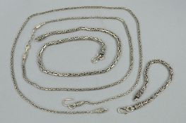 THREE NECKLACES AND A BRACELET, all designed as fancy link tubular like chains, one with a spring