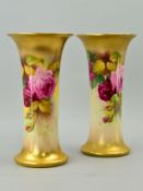 TWO ROYAL WORCESTER TRUMPET VASES, painted with Roses, one signed K H Blake, green backstamps and