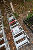 A WOODEN DOUBLE EXTENSION LADDER, and two Ali step ladders (3)