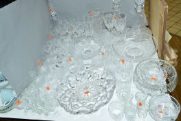 A COLLECTION OF GLASSWARE, including bowls, dishes, decanters and drinking glasses