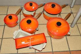 A SET OF FIVE LE CREUSET COVERED SAUCEPANS, (three lids chipped), together with a Le Creuset