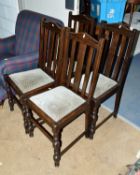 A SET OF FOUR 20TH CENTURY OAK DINING CHAIRS