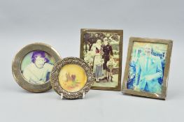 FOUR VARIOUS SILVER PHOTOGRAPH FRAMES, two rectangular and two circular, various dates and makers,