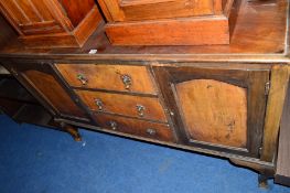AN EDWARDIAN WALNUT MIRROR BACK SIDEBOARD, with three central drawers, approximate size width
