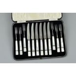 A CASED SET OF MOTHER OF PEARL HANDLED DESSERT KNIVES AND FORKS, black line detail, stainless