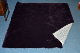 A STEPEVI PURPLE LOUNGE RUG, approximate size 180cm x 180cm