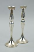 A PAIR OF MODERN CONTINENTAL SILVER CANDLESTICKS, stamped 925 to bottom edge, loaded bases, height