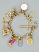 A MID TO LATE 20TH CENTURY CHARM BRACELET, fancy textured oval links fitted to a bolt ring fastener,