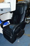 A BLACK LEATHER MASSAGING CHAIR