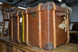 A VINTAGE WOODEN BANDED TRUNK, with travel labels, approximate size width 94cm x depth 56cm x height