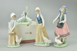 A LLADRO FIGURE, girl feeding duck, together with three Nao figures, to include boxed Duck group,