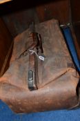 A DISTRESSED BROWN LEATHER GLADSTONE BAG