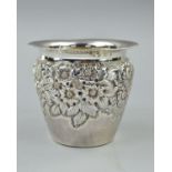 AN EDWARDIAN SILVER PLANT HOLDER, beaded rim, floral embossed body, makers Walker & Hall, Birmingham