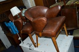 A PAIR OF MID 20TH CENTURY BROWN LEATHERETTE ARMCHAIRS