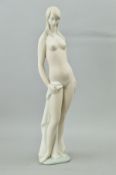 A LLADRO NUDE FIGURINE, in matt finish, standing holding a towel, height approximately 46cm